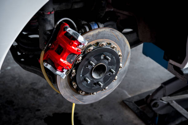 Checking car brake system for repair at car garage stock photo