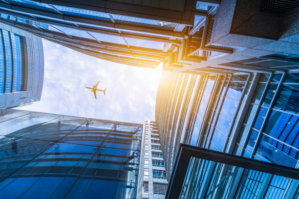istock plane flying over the skyscrapers 1482744958
