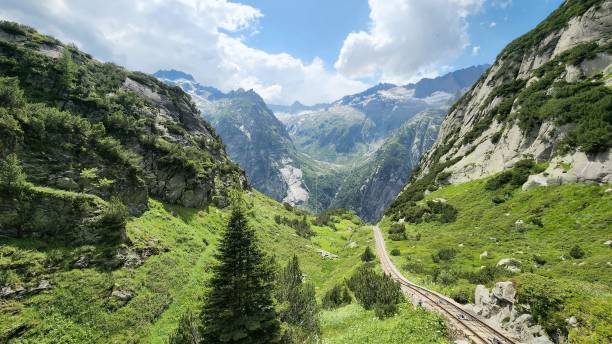 istock Railway line through a valley with mountains in the background 1482746785