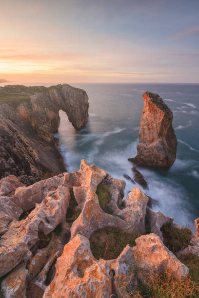 istock Rocks and clifs over sea at sunset 1482747748