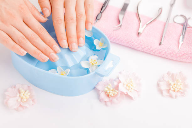 istock Female manicure with beautiful young woman's hands 1482748057