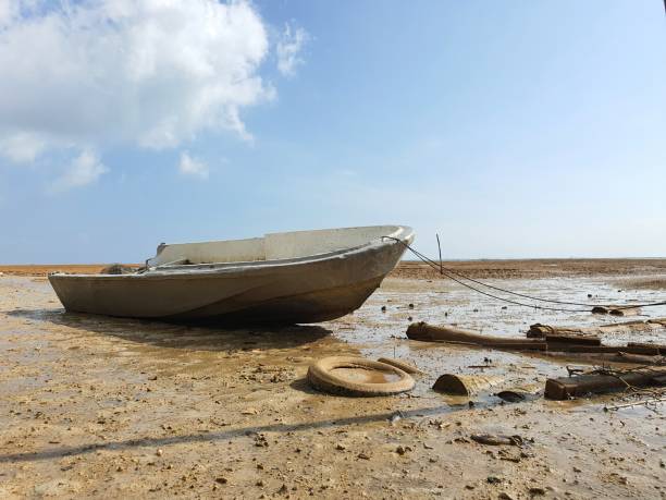 istock Anchored boat in coastline 1482750206