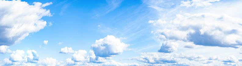 Blue sky, cloudscape cloudy background banner panorama long panoramic , with clouds and sunshine sunlight