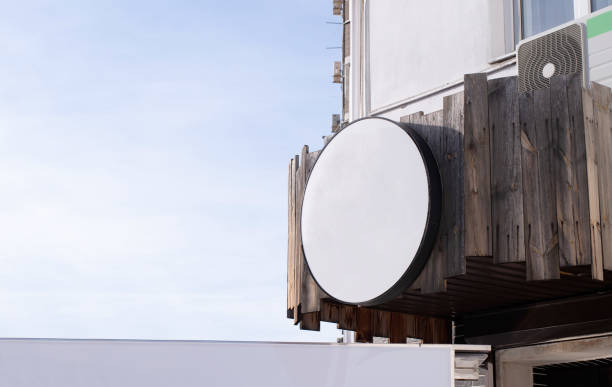 istock white round logo on building wall , exterior for mockup design 1482752298