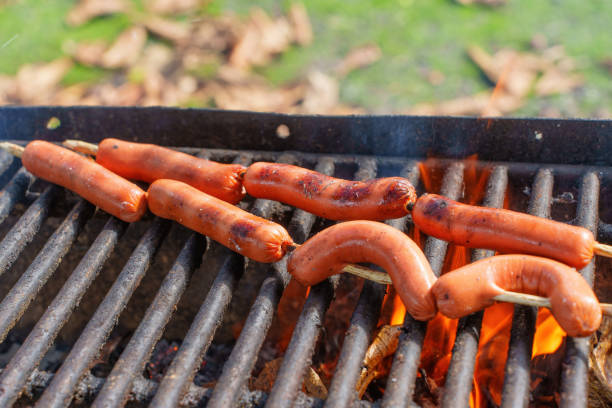 istock Grilling Sausage in a Barbecue Fire 1482752569
