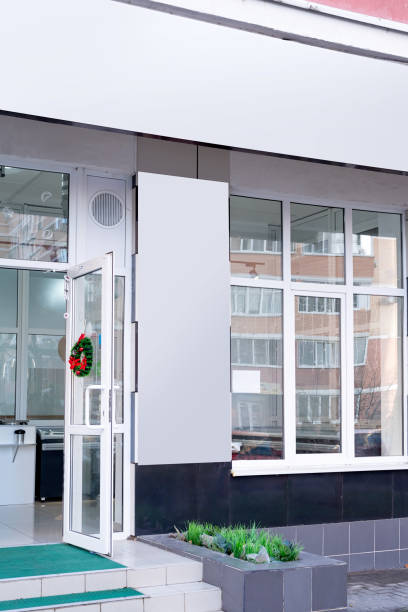 istock white rectangle logo on wall with windows ,exterior for mockup design 1482754500
