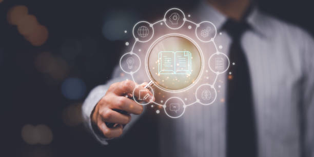 istock man holding a magnifying glass and showing learning with virtual icons ,professional courses , e-learning, learning new things ,business education ,personal development plan make business successful 1482755551