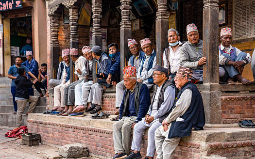 Nepalese Senior citizen observing  during the celebration of Biska Sindur Jatra Festival in Thimi, Bhaktapur,  Nepal, on  Thursday April 13, 2023