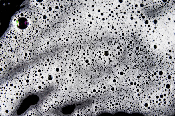 istock Abstract background white soapy foam texture. Shampoo foam with bubbles 1482758107
