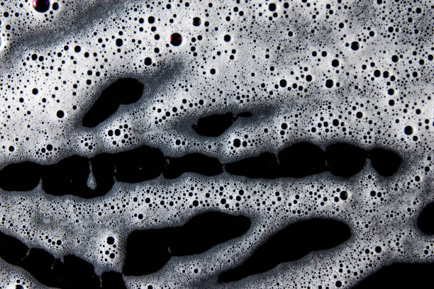 istock Abstract background white soapy foam texture. Shampoo foam with bubbles 1482758117
