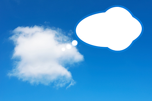 Blank speech bubbles against blue sky with copy space.\nSocial Media Chat Bubbles