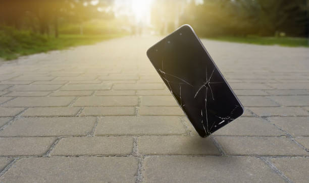 istock A smartphone with a broken display falls on a bridge in front of a park and sunlight 1482758982
