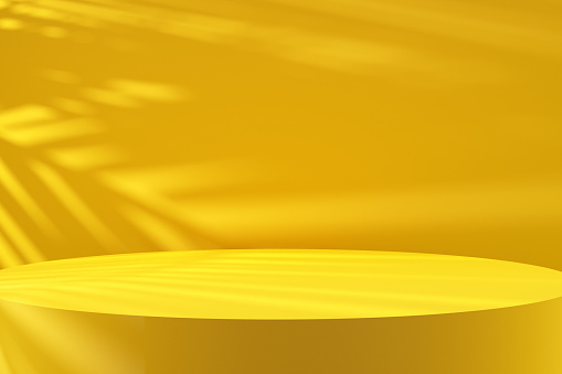 Close up round yellow colored podium with tree leaf shadows and natural sunlight. Background for luxury beauty, cosmetic or product display backdrop. 3D render.