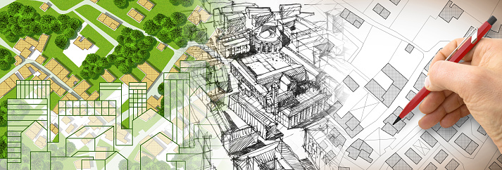 Planning a new city - Engineer-architect drawing with a pencil a sketch of a new modern imaginary town - concept image.