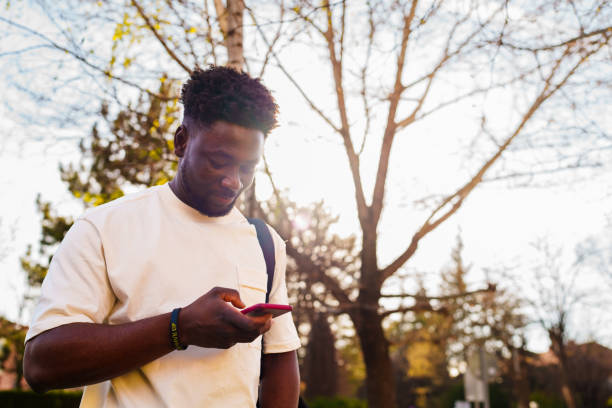 istock Young man using mobile phone, outdoors 1482765816