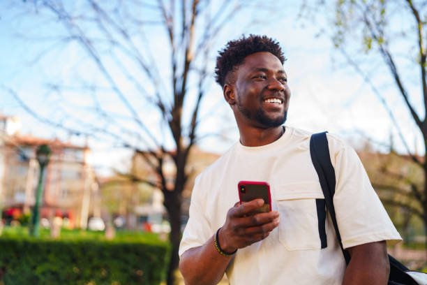 istock Young man using mobile phone, outdoors 1482765837