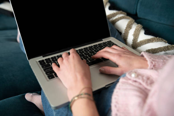 istock Hands of an Anonymous Woman Using her Laptop to Work from Home 1482765922
