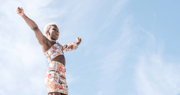 istock Happy black non-binary person dancing on street and enjoying freedom 1482768402
