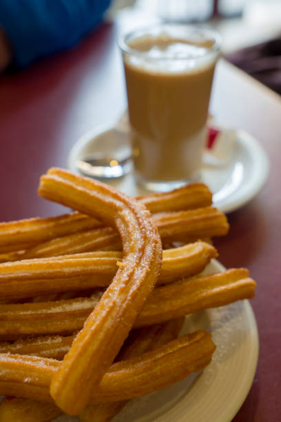 istock Churros and hot coffee, Spanish breakfast 1482768444