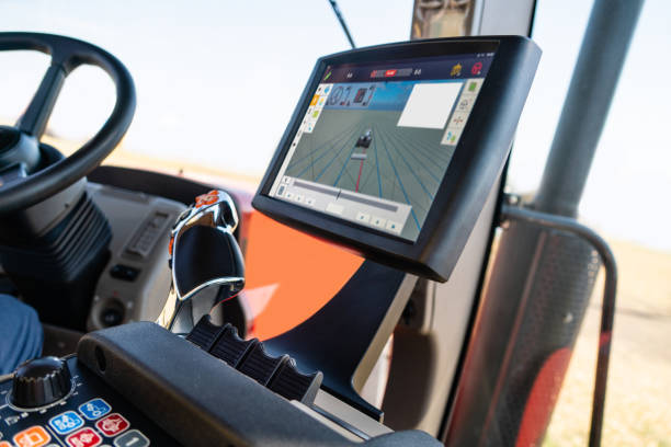 Cockpit of autonomous tractor working on the field.