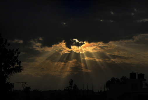Light Rays Coming Through Storm Clouds - Stock Photo