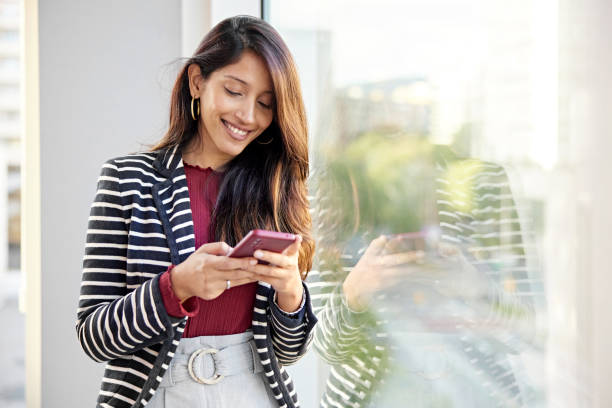 istock Young businesswoman checking smart phone 1482770768