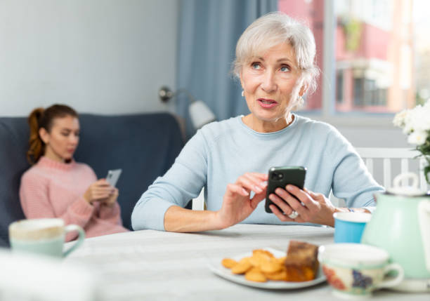 istock Positive elderly woman using smartphone to chat with friends 1482771301
