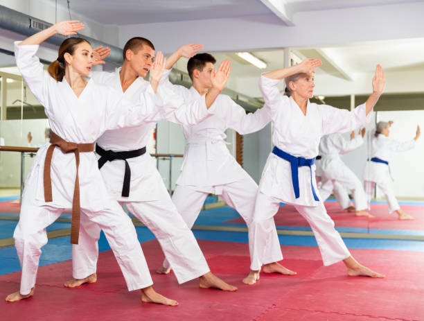 istock Women and men doing kata during karate training 1482773172