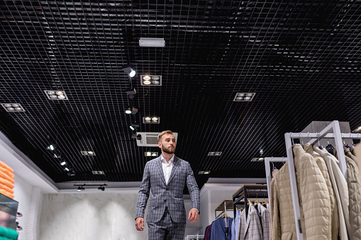 Elegant man walks around the store