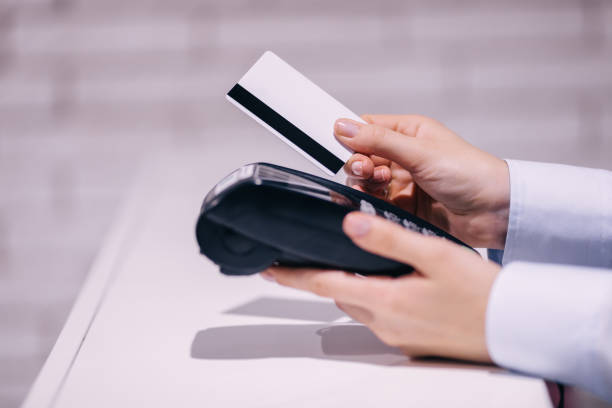 istock credit card with electronic payment terminal 1482775740