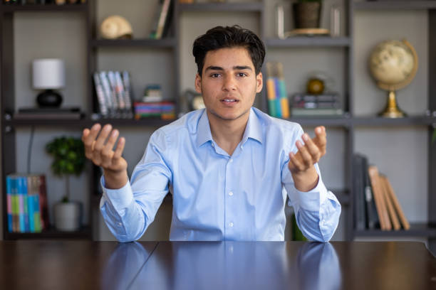 istock Young man talking on a video call and looking at the camera 1482778381