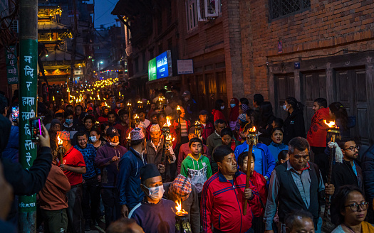 Nepalese hindu devotees carrying burning torches to the celebration of Biska vermilion powder Festival in Thimi, Bhaktapur,  Nepal, on  Friday April 14, 2023