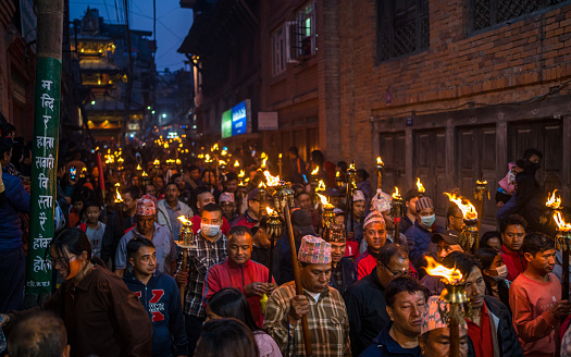 Nepalese hindu devotees carrying burning torches to the celebration of Biska vermilion powder Festival in Thimi, Bhaktapur,  Nepal, on  Friday April 14, 2023