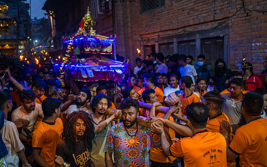 Nepalese hindu devotees carrying wooden Chariot to celebration of Biska vermilion powder Festival in Thimi, Bhaktapur,  Nepal, on  Friday April 14, 2023