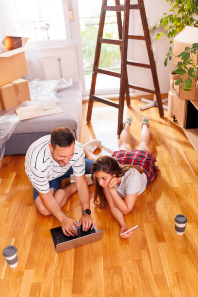 istock Couple searching for home redecoration ideas 1482783908