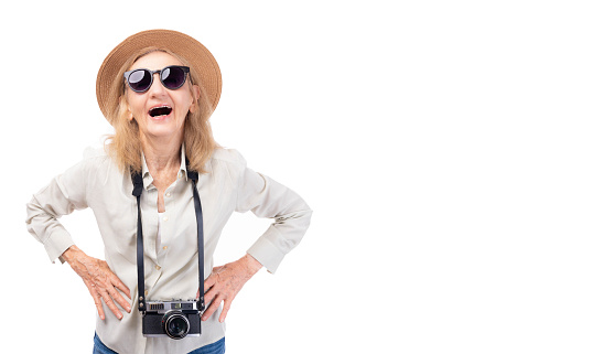 Happy elderly woman laughing Old lady going to travel on holiday wear hat sunglasses camera Tourist travel abroad in free time rest getaway Air flight trip journey long weekend holiday concept