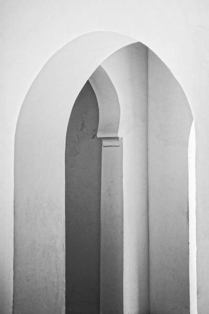 Arched doorway symmetry architecture, Moorish style, black and white abstract architectural simplicity art stock photo