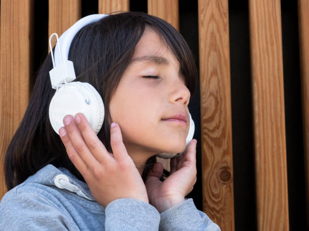 istock Child feeling the music 1482788647