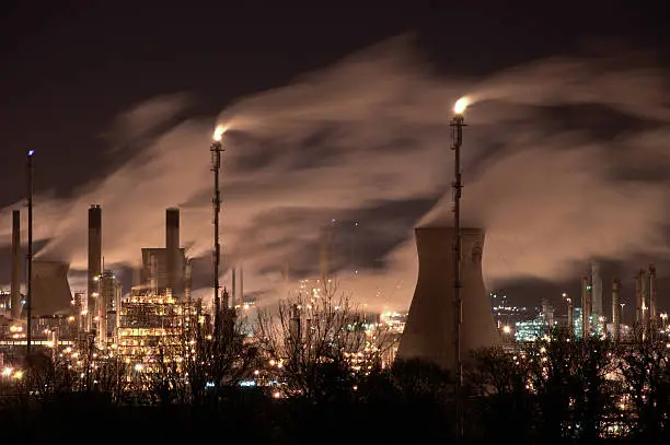 Night photo of Grangemouth petrochemical. Smoke and light the working of the factory.