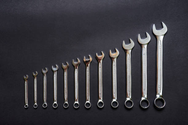 istock Set of wrenches on black background. Tools spanners. Technique repair, equipment for mechanical service, labor or father's day concept. Flat lay, top view, copy space 1482790655