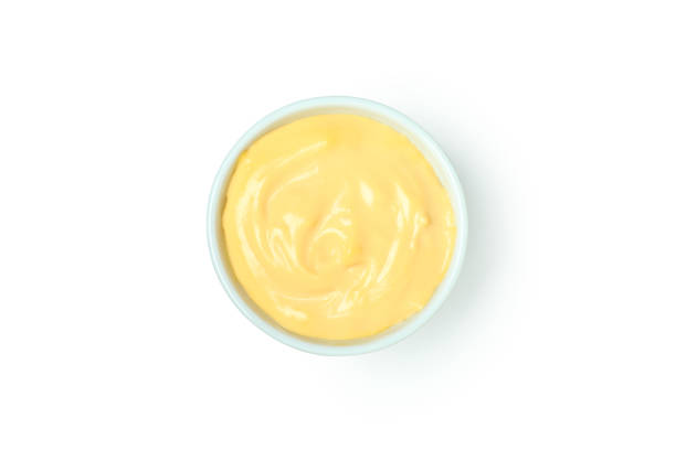 istock Bowl with cheese sauce isolated on white background 1482790664