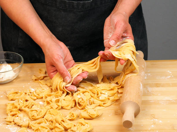 istock Chef prepares pasta at home in the kitchen 1482790669