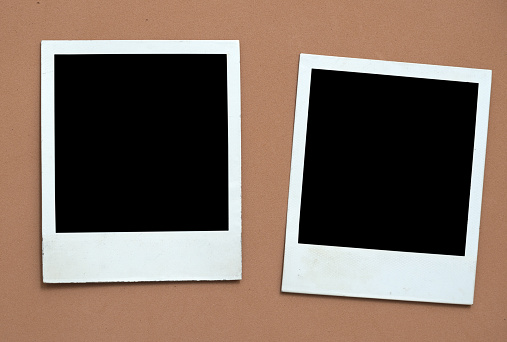 Photo frames on brown background