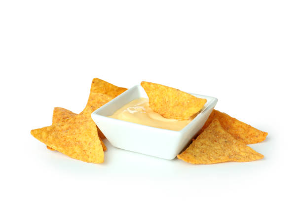 Bowl with cheese sauce and chips isolated on white background