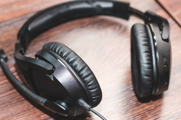 istock Gaming headphones with a microphone headset on the table 1482798593