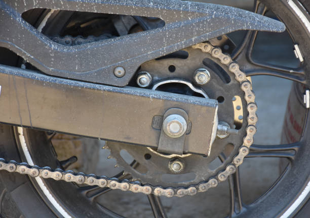 istock Close up of motorcycle gear chain system and wheels. 1482798603