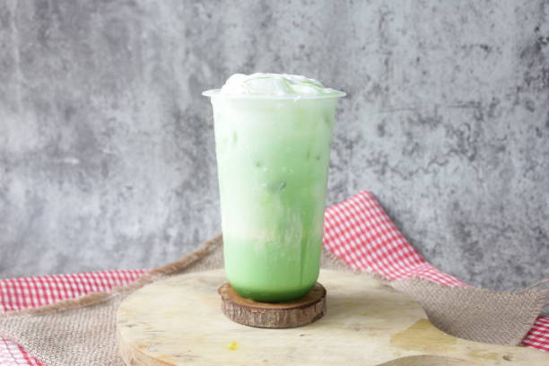 istock Fresh Delicate Green Milk Tea on the Table 1482799504