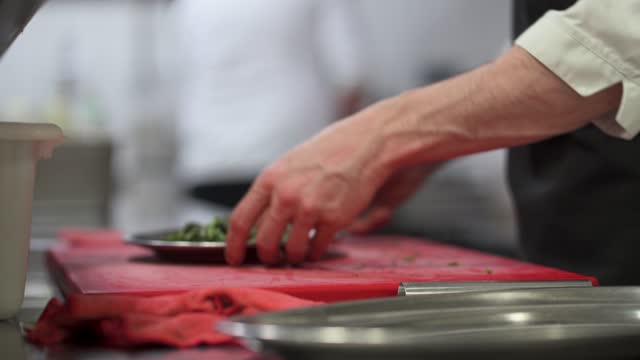chef cutting asparagus