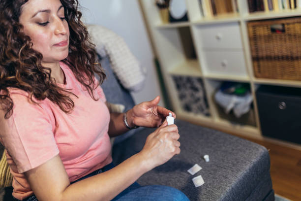 istock Woman at home using products for hormone replacement therapy. 1482799998