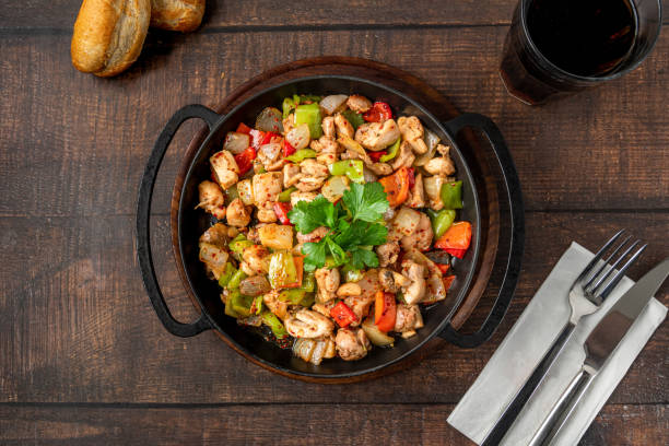 istock Sauteed chicken with pepper in a cast iron pan 1482800075